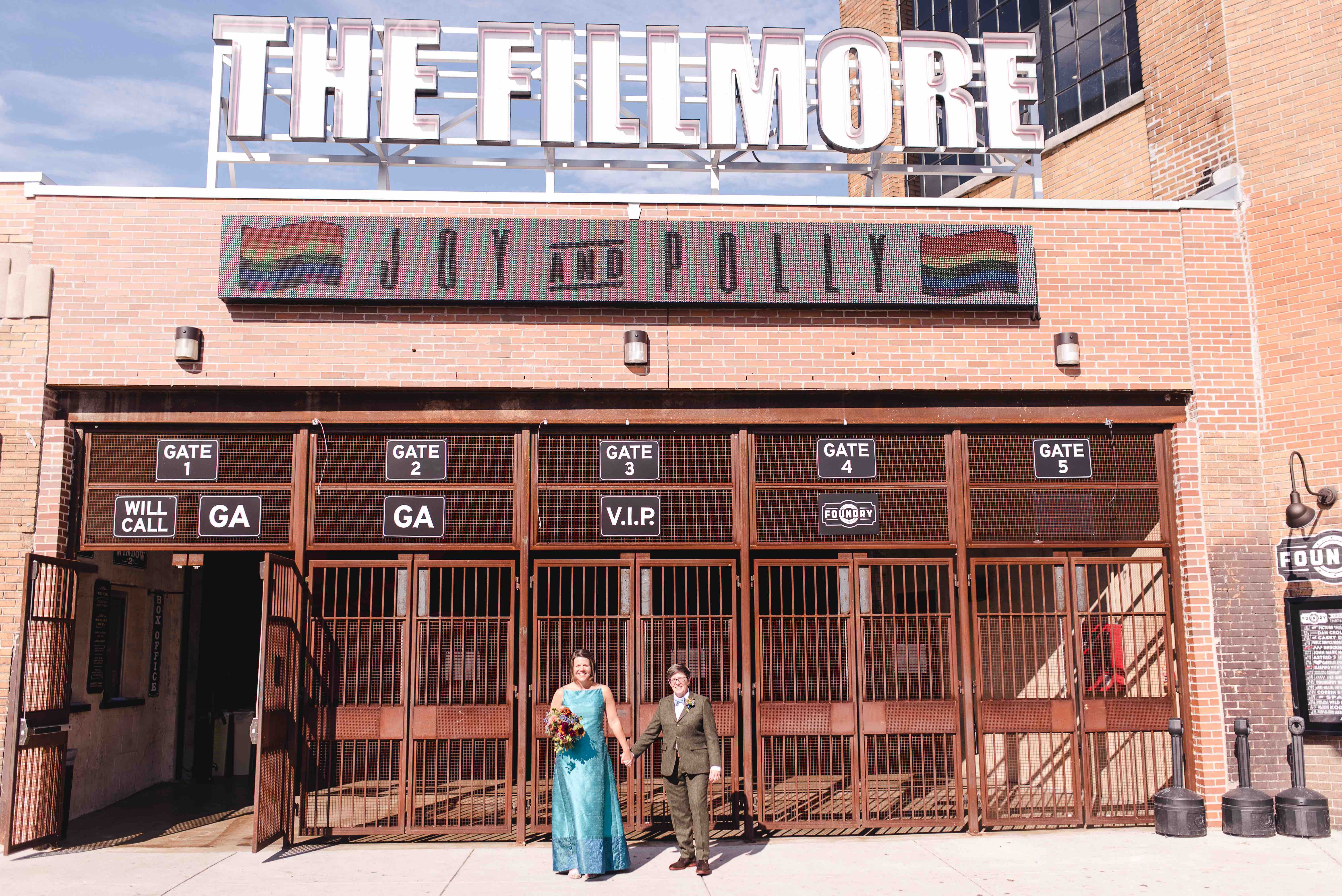 Two women pose outside of  Live Nation Special Events’ The Fillmore Philadelphia on their wedding day